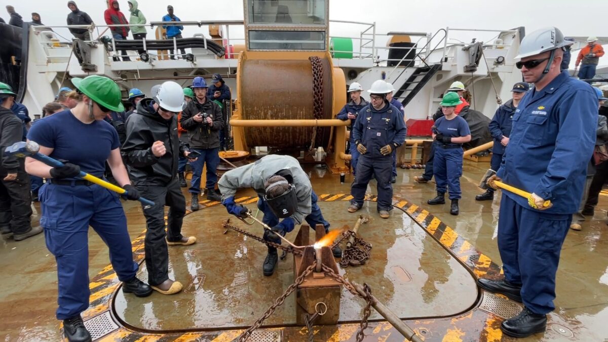 Rear Admiral Bob Little (right) and Ensign Camden Martin prepare to take part in the heat-and-beat competition on Wednesday in Juneau. (Photos/Video by Greg Knight)