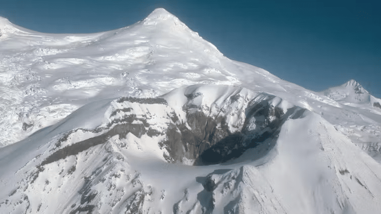 One of two main craters on Alaska’s Mount Spurr, shown in 1991. Earthquake activity suggested the volcano was close to erupting again in 2025. (Photo by R.G. McGimsey/Alaska Volcano Observatory/U.S. Geological Survey, CC BY)